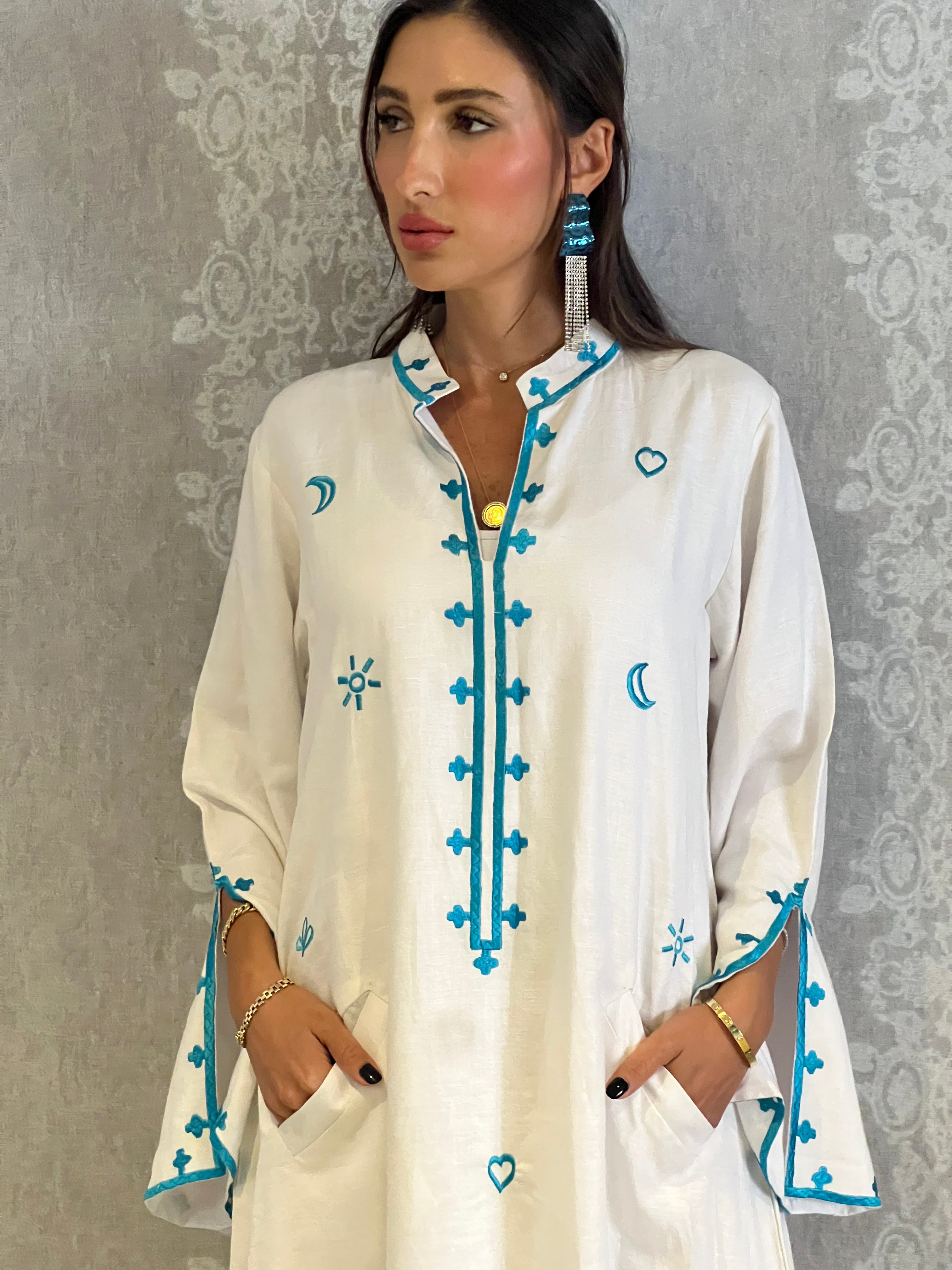 Mona from Morocco: Traditional White Abaya with Blue Embroidery