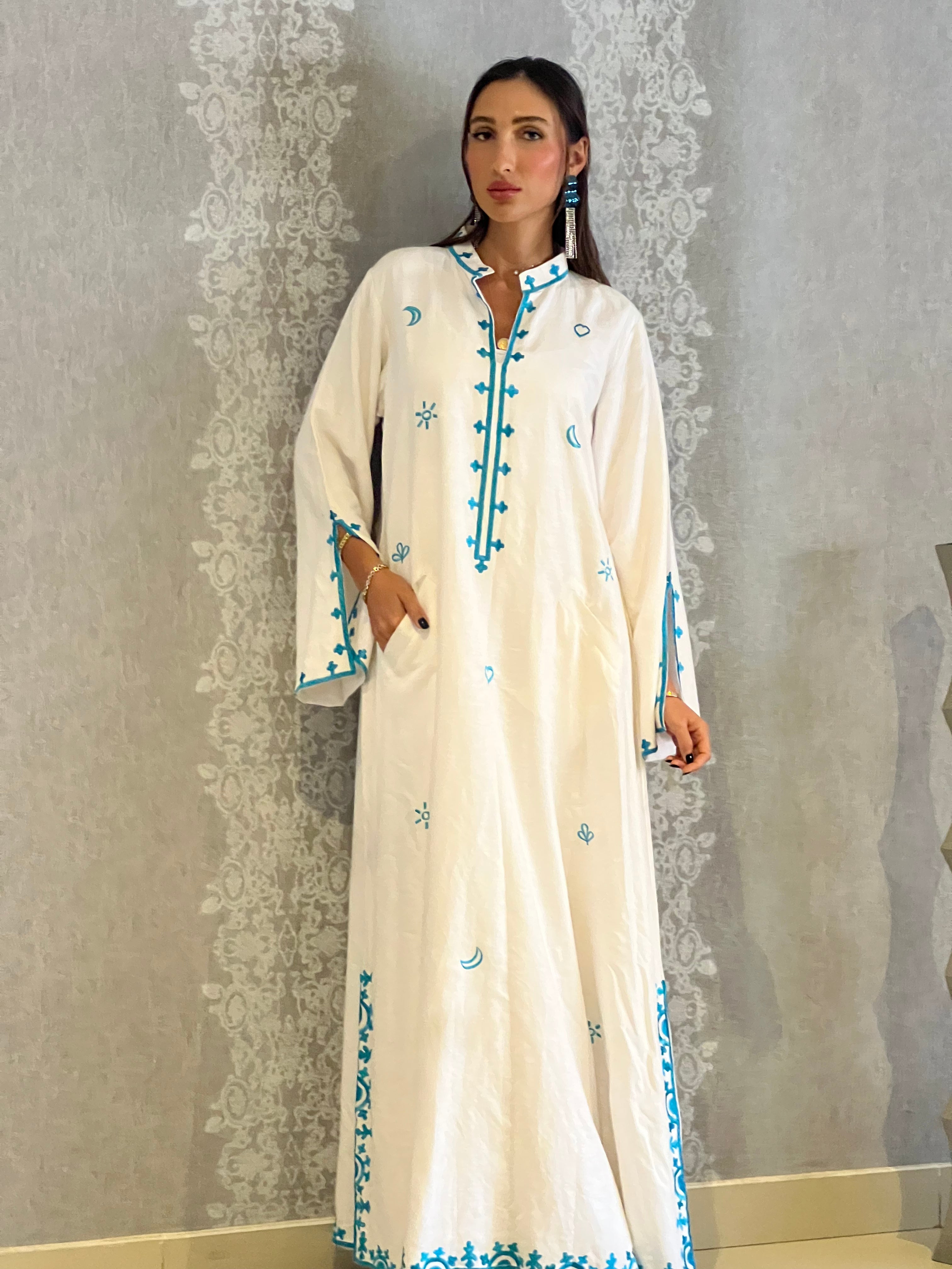Mona from Morocco: Traditional White Abaya with Blue Embroidery
